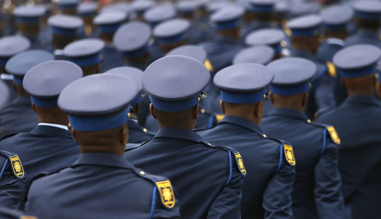 PRETORIA, SOUTH AFRICA – DECEMBER 21: Newly trained police officials perform a drill during the South African Police Services (SAPS) pass out parade at SAPS Academy on December 21, 2018 in Pretoria, South Africa. More than 3500 SAPS trainees have successfully completed the Basic Police Development Learning Programme. (Photo by Gallo Images / Phill Magakoe)